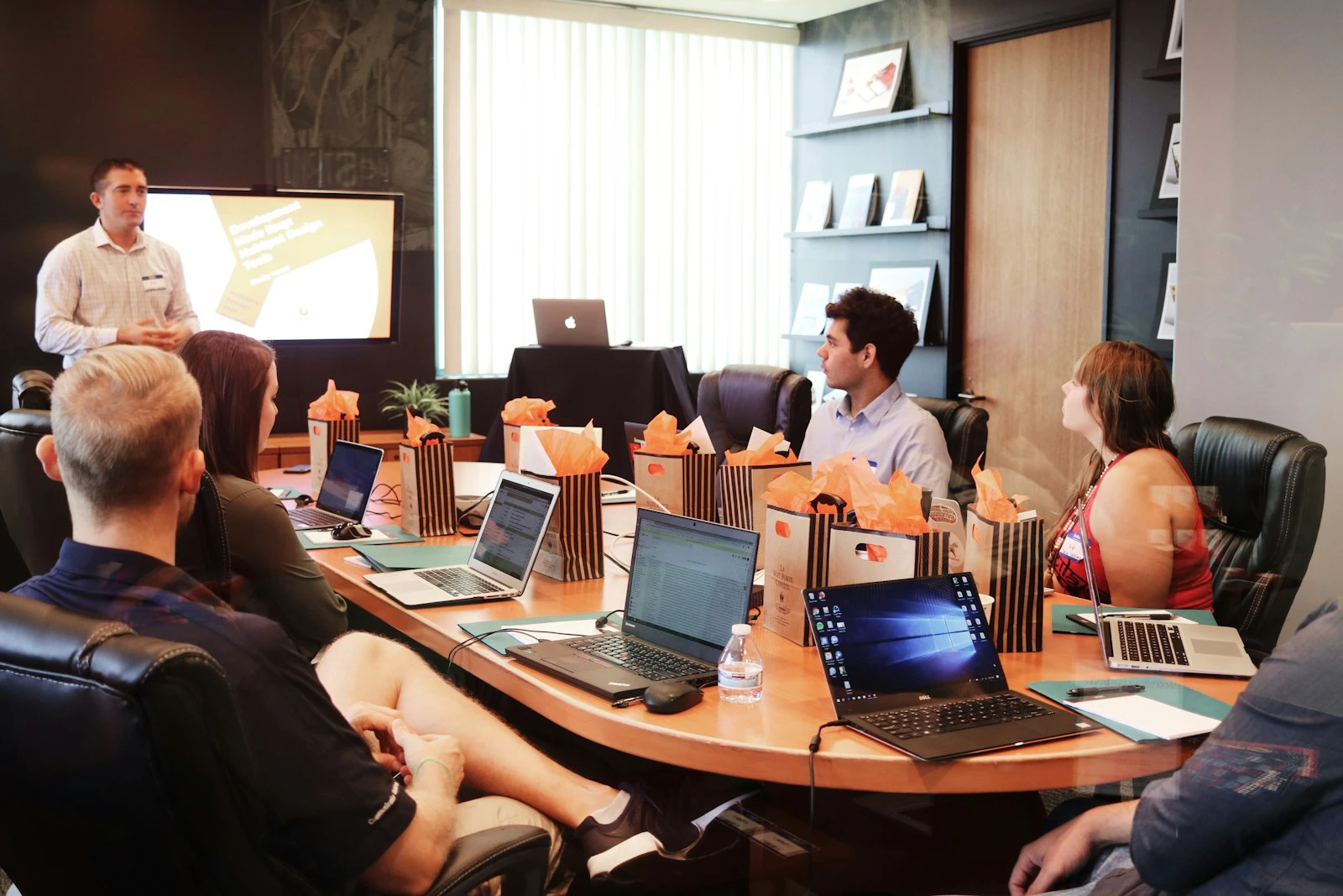 Team in a workshop session around a long table
