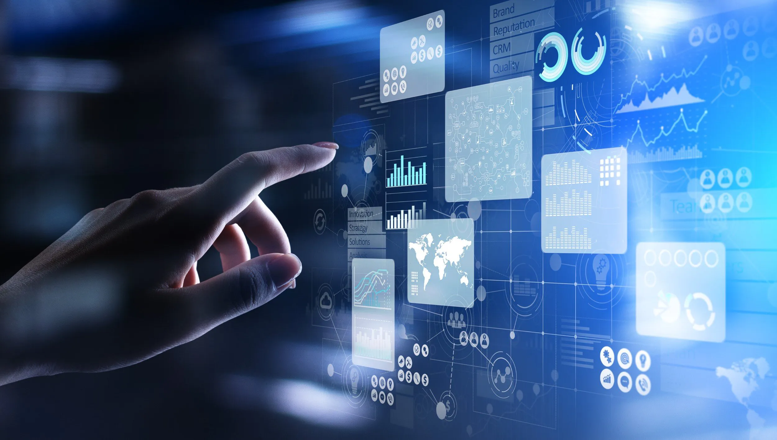 Hand touching a virtual screen with business analytics